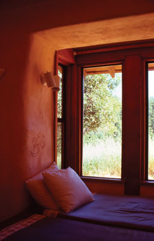 
One worthwhile benefit of straw-bale walls is the ease of creating such feel-good details as window seats.
